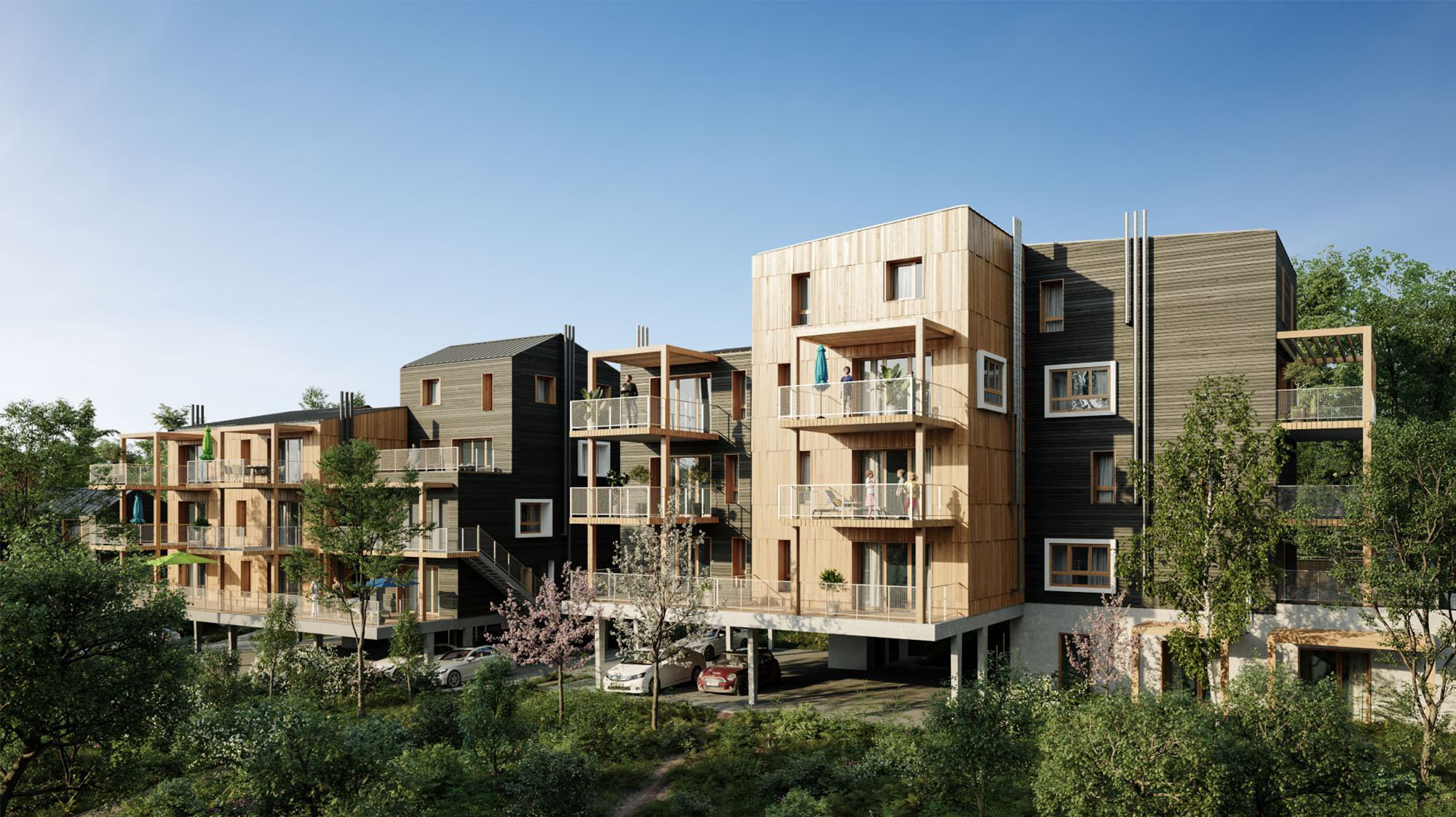 Bâtiment neuf avec bardage bois extérieur et parking semi enterré sous les pilotis