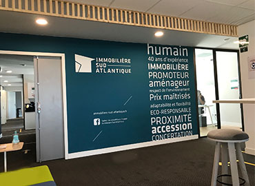 Peinture aux murs des valeurs de la marque Immobilière Sud Atlantique dans ses locaux